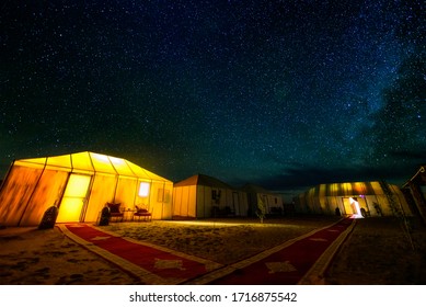 A Milky Way Above A Desert Camp In Sahara Desert In Morocco. 