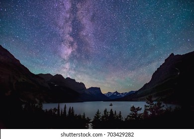 milky way above saint mary lake in glacier national park, montana, on summer night