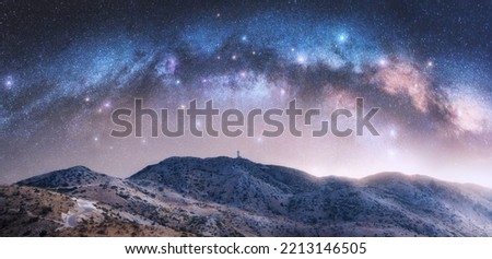 Milky Way arch over the mountain hills at starry night. Sky with bright stars and arched milky way in summer in Lefkada, Greece. Nature. Beautiful mountain landscape. Space background. Galaxy