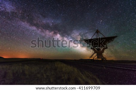 Milky way and big antenna dish at Very Large Array, New Mexico, USA. Powerful telescope for astronomy searching