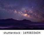 Milky way galaxy at mountain with stars and space dust in the universe, long speed exposure, Night landscape with colorful Milky Way, Starry sky with hills, Beautiful Universe, Space background.