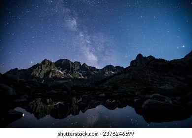 Milky way and moonlight in Posets Maladeta Nature Park, Spain. - Powered by Shutterstock