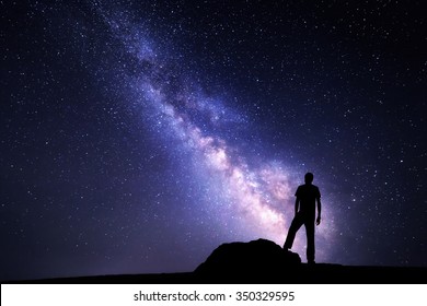 Milky Way. Night Sky With Stars And Silhouette Of A Man