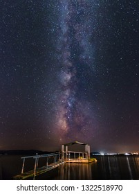 Milky Way Over A Boat Jetty In The Sea. Grichenand In Ouranoupolis Near Thessaloniki On The Beach Was This Great Milky Way Photo With Center