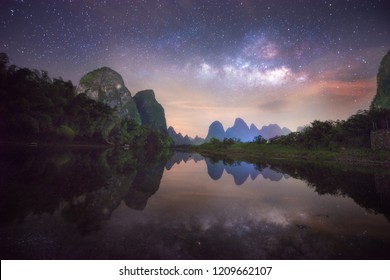 The milky way reflection on the Li river, Xinping, China.  