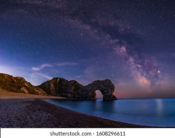 Milky Way Rising Over Durdle Door In Dorset, UK