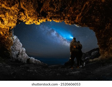 Milky Way seen from the Bulgarian shore, from a cave, on the rocky Black Sea shore, together. - Powered by Shutterstock