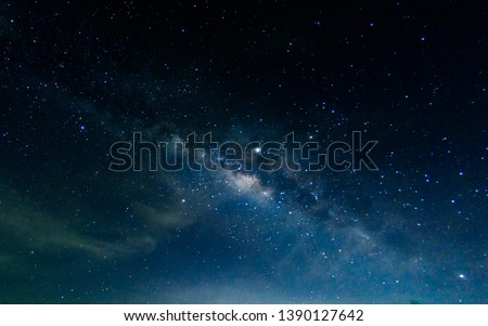 Milky Way with stars shining brightly beautiful at night on the sky background in Thailand