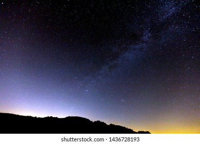Milky way and sunset over city Sumperk