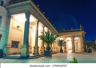 The Mill Colonnade Mlynska kolonada Neo-Renaissance building with columns and hot springs in spa town Karlovy Vary Carlsbad historical city centre, night evening view, West Bohemia, Czech Republic