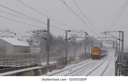 Mill Hill, London / UK - 01/20/13: British Rail Class 319 Leaving Mill Hill Broadway Station.