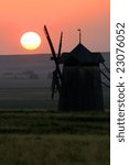 Mill on sunset in steppe.