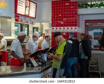 Mill Valley, CA October 13, 2018: Diners Lined Up Behind Cashier And Checkout Counter At In-N-Out