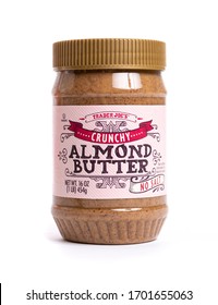 Millburn, New Jersey, USA - April 11, 2020: A Plastic Jar Of Trader Joe's Crunchy Almond Butter Isolated On A White Background.