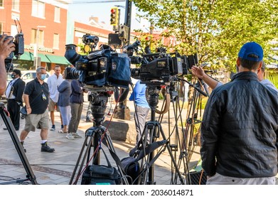 Millburn, New Jersey, USA - September 3, 2021: TV Crew And Cameras Await Governor Phil Murphy Press Conference Regarding Tropical Storm IDA In Millburn New Jersey. People Can Be Seen.