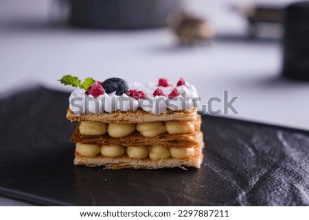 Mille Feuille  means one thousand sheets, layers, or leaves. It's an old-school French pastry that's airy, crispy, flaky, and decadent in all the right places.