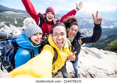 Millenial Friends Taking Selfie On The Top Of The Mountain - Young People On A Hiking Trip Celebrate Reaching The Summit - Hikers Climbing Cliff Together