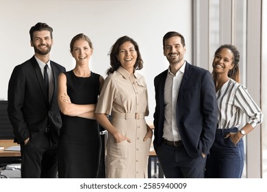 Millennial 35s office employees led by mature 50s female boss posing at workplace, look at camera, feel satisfied with career growth and professional achievement and perspectives. Business, teamwork - Powered by Shutterstock - Get 15% off with code: PIKWIZARD15