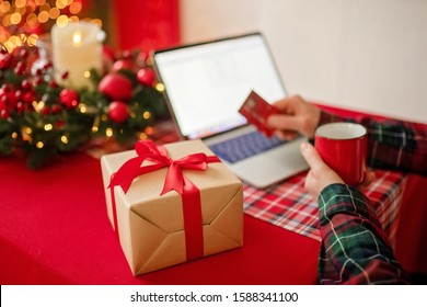 Millennial Adult Man Makes Holiday Gifts Online Shopping On Laptop. Merry Christmas And Happy New Year