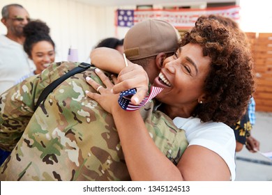 Millennial black soldier returning home to his family, embracing his mother, close up - Powered by Shutterstock