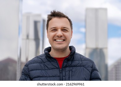 Millennial Caucasian Man Smiling Happy Standing At City Outdoors