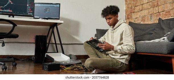 Millennial Gen Z Ethnic Male Trader Repair Computer Hardware, Install New RAM Memory Equipment On Modern Gadget. Young African American Man Fix PC Gadget. Upgrade, Electronic Service Concept.