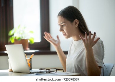 Millennial Generation Young Adult Woman Looking In Laptop Computer, Fling Arms Up.  She Just Found Mistake In Last Assignment, Error In Contract, Disagreement In Email Or Dissatisfied Buyer Message.