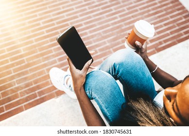 Millennial Girl Mask Sitting In The City Using Mobile Smart Phone With Black Screen - Female Student Holding Phone Outside School - Young People And Technology Concept