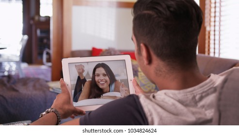 Millennial Man Video Chatting Or Having A Facetime Conversation With His Girlfriend On Tablet Computer