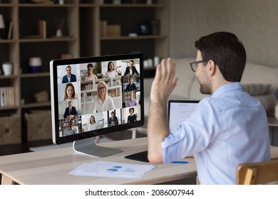 Millennial Office Employee Meeting, Talking To Business Team On Video Call, Negotiating With Office Coworkers On Online Virtual Conference Chat, Waving Hand Hello At Monitor, Discussing Project