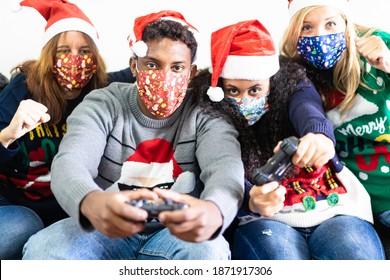 Millennial People Having Fun With Video Games Console On Christmas Time.  Family Playing Video Games All Day In The Apartment For Lockdown. Christmas,coronavirus And Technology Concept. Focus On Boy.