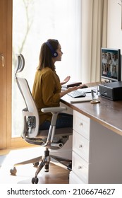 Millennial student, intern girl in headphones watching learning webinar, attending virtual online training, studying at home. Business woman, employee talking to team on video call, conference chat