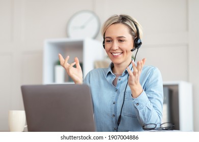 Millennial Teacher Giving Online Lesson On Webcam From Home, Blogger Broadcasting On Air. Young Tutor In Headphones Participating In Educational Or Business Web Conference On Laptop