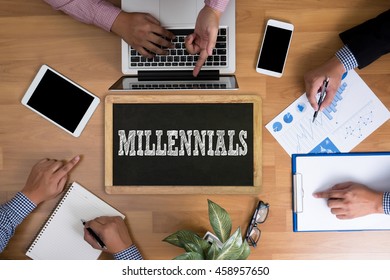 MILLENNIALS  Business Team Hands At Work With Financial Reports And A Laptop, Top View