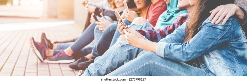 Millennials friends watching social story on smart mobile phones - People addiction to new technology trend - Concept of youth, z generation, social and friendship - Focus on close-up hand phone