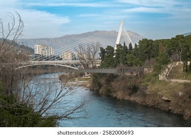 The Millennium Bridge is a cable stayed bridge. Millennium bridge over Moraca river in Podgorica, Montenegro. Travel photo, selective focus