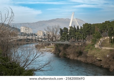 The Millennium Bridge is a cable stayed bridge. Millennium bridge over Moraca river in Podgorica, Montenegro. Travel photo, selective focus