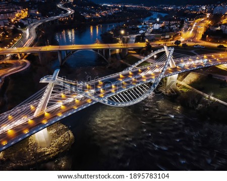 Millennium Bridge illuminated at dusk in Ourense, Galicia