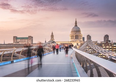 The Millennium Bridge To The St Paul's Cathedral In Twilight With Moving People