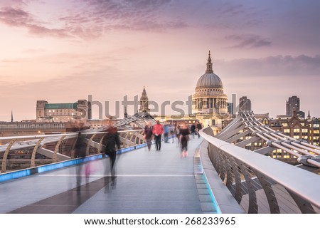 The Millennium Bridge to the St Paul's Cathedral in Twilight with Moving People