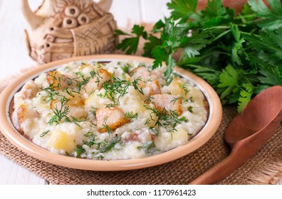 Millet Porridge With Bacon In A Dish On The Table. Russian Kitchen