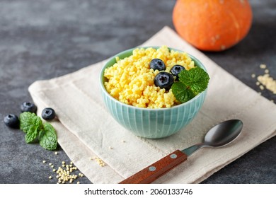 Millet Porridge With Pumpkin And Berries In A Bowl On The Table. Baby Food. Healthy Breakfast