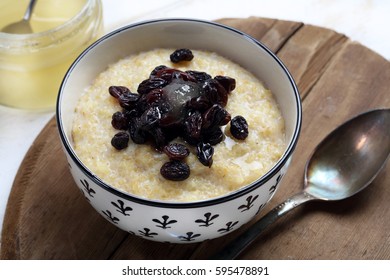 Millet Porridge With Raisins And Light Honey