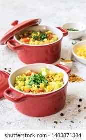 Millet With Vegetables In Red Ramekins, White Background