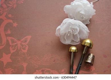 Millinery and hat making tools, Silk Flowers and thimble - Powered by Shutterstock