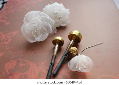 Millinery and Hat Making Tools, Silk Flowers and Thimble - Powered by Shutterstock