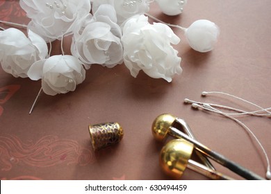 Millinery and Hat Making Tools, Silk Flowers and Thimble - Powered by Shutterstock