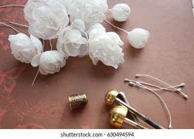 Millinery and Hat Making Tools, Silk Flowers and Thimble - Powered by Shutterstock