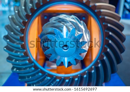 Milling machine. Background with metallic details. Gears. Bevel gears. Concept - metalworking. Differential. Concept - Development of industrial equipment. Industry. Industrial background