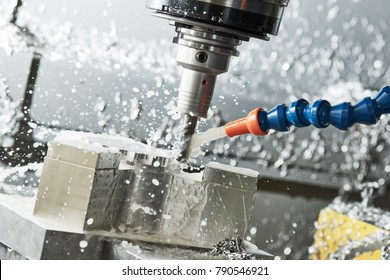 Milling metalworking process. Industrial CNC metal machining by vertical mill - Powered by Shutterstock